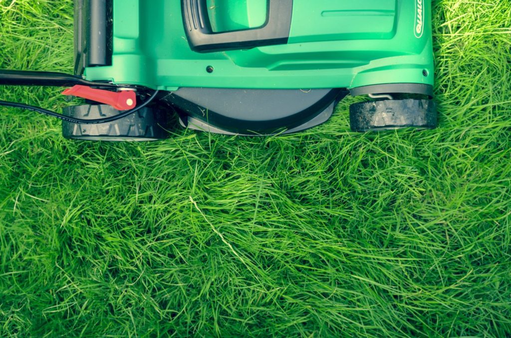 Image of a lawn mower on grass