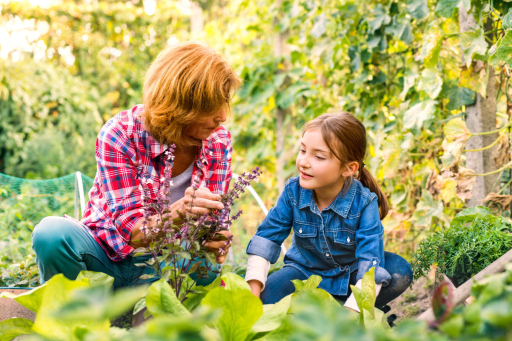 Image of a woman and child gardening together